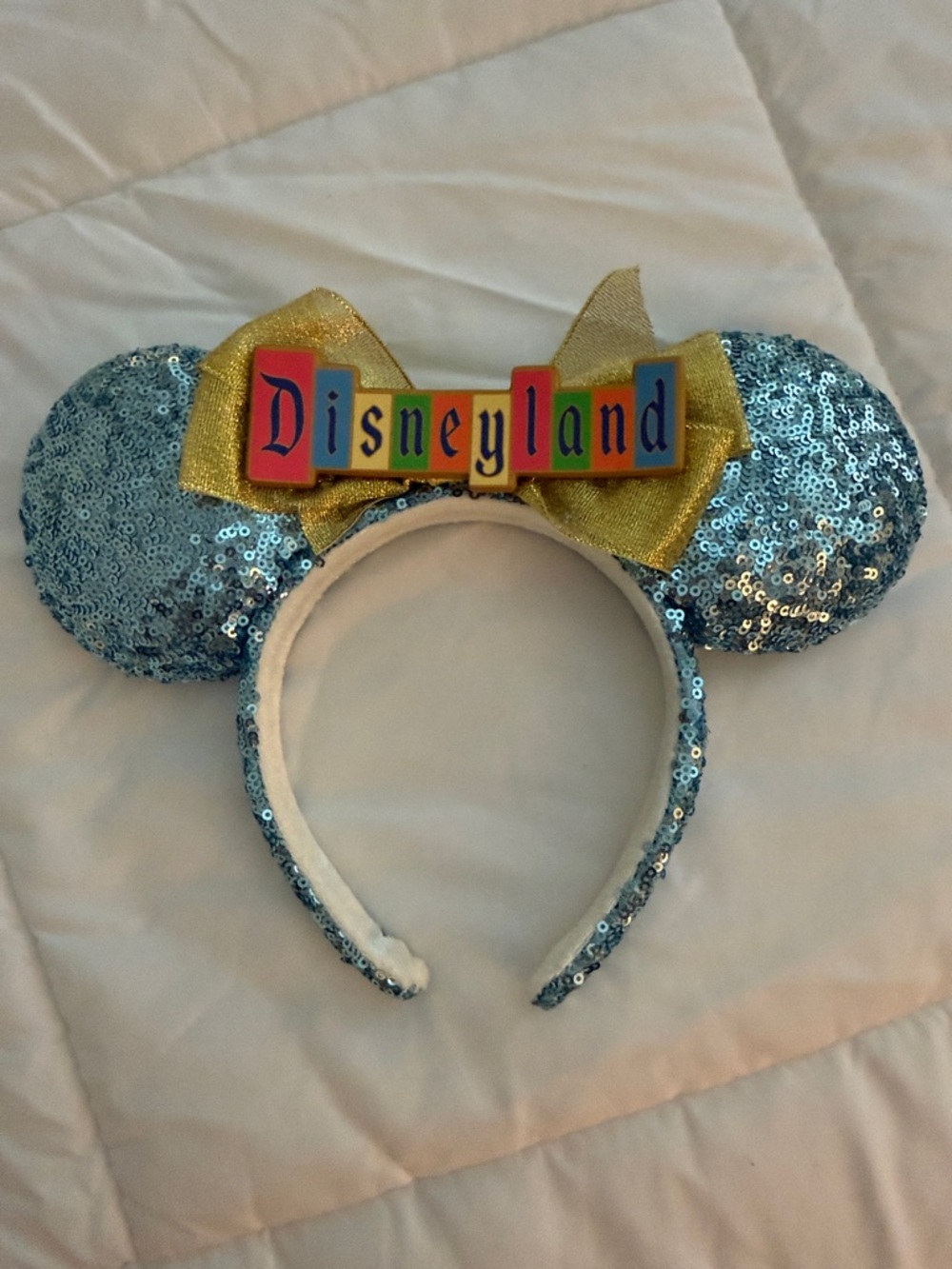 Disney 70th Anniversary Sequin Mouse Ear Headband in Light Blue with Gold Bow